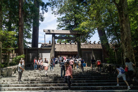 Ise, Japan - 28 6 19: Tourists praying at the main shrine building at ise jingu shrineのeditorial素材