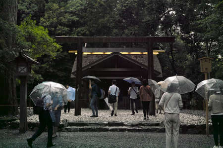 Ise, Japan - 27 6 19: People praying at a smaller shrine located on the Ise Jingu groundsのeditorial素材