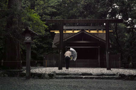 Ise, Japan - 27 6 19: People praying at a smaller shrine located on the Ise Jingu groundsのeditorial素材