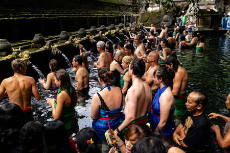 Bali, Indonesia - 29 5 19: People bathing in the holy fountains at Tirta Empul temple in Ubudのeditorial素材