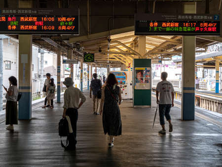 Tokyo, Japan - 27 8 19: People waiting to board trains at Tanashi station.のeditorial素材