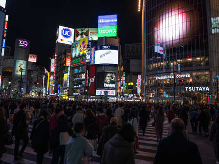Shibuya, Japan - 7.2.20: Large crowds crossing Shibuyas famous scramble crossingのeditorial素材