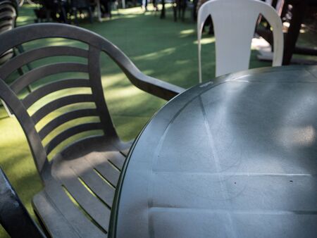 Plastic table and chairs set up outside.の写真素材