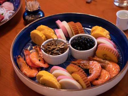 The table being set for a traditional new years dinner in Japanの写真素材