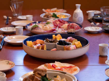 The table being set for a traditional new years dinner in Japanの写真素材