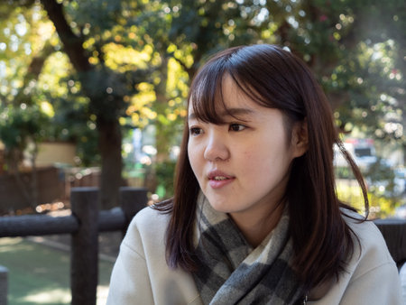 A Beautiful young Japanese woman looking off cameraの写真素材