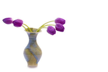 Colorful purple tulips in a beautiful vase. Copy Space on rightの写真素材