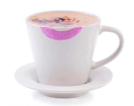 Coffee cup with lipstick print on white backgroundの写真素材