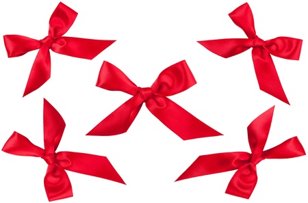 Set of five red ribbon bows in different position isolated on whiteの写真素材