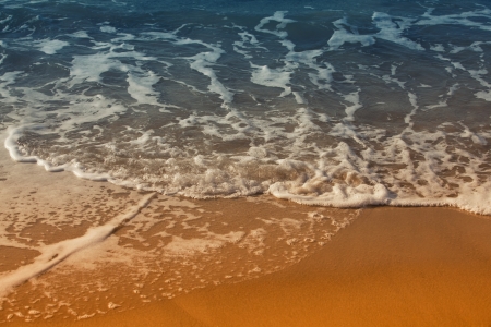 Sea waves and sand background の写真素材