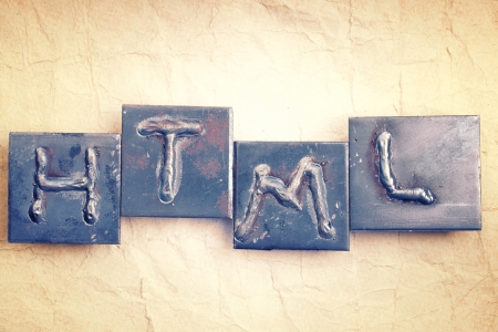 Abbreviation HTML made from metal letters on an old vintage paper backgroundの写真素材