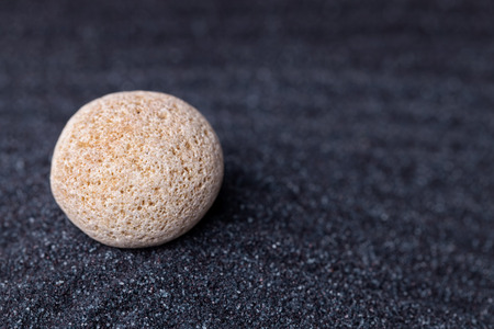 An old limestone rock in a relaxing zen gardenの写真素材