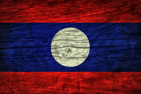 Vintage flag of Laos on wooden surfaceの写真素材