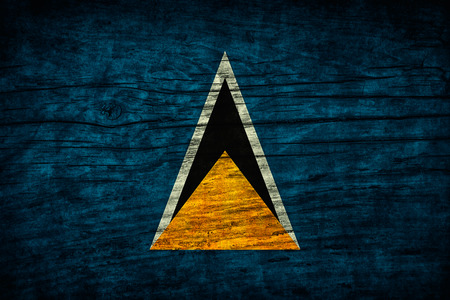 The  vintage flag of Saint Lucia on wooden surfaceの写真素材