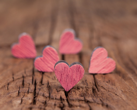 Many valentines pink hearts  on a wooden surfaceの写真素材