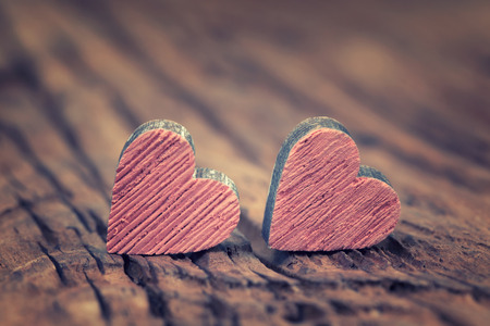 Two valentines  hearts  on a rustic wooden surfaceの写真素材