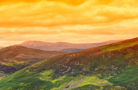 Dramatic orange sunset in Irish mountains  landscapeの写真素材