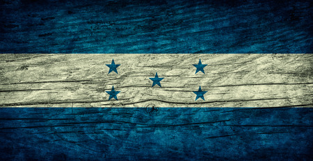 National vintage flag of Honduras on wooden surfaceの写真素材