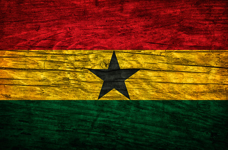 Vintage flag of Ghana on wooden surfaceの写真素材