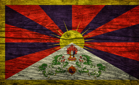 Vintage Tibetan flag or snow lion flag of on wooden surfaceの写真素材