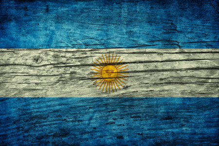 Vintage flag of Argentina on wooden surfaceの写真素材