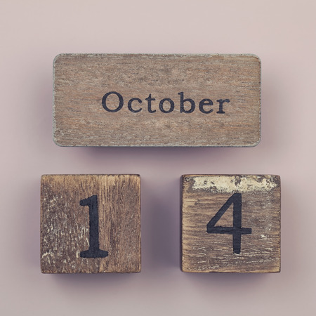 Wooden vintage calendar showing the date 14th of Octoberの写真素材