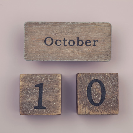 Wooden vintage calendar showing the date 10th of Octoberの写真素材