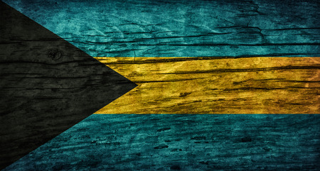 Vintage flag of the Bahamas on wooden surfaceの写真素材