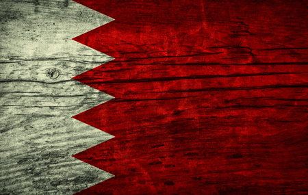 Vintage flag of Bahrain on wooden surfaceの写真素材