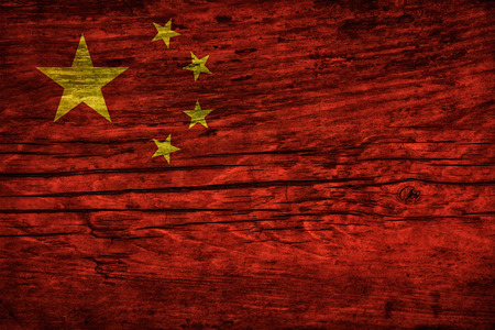 Vintage flag of the People's Republic of China on wooden surfaceの写真素材