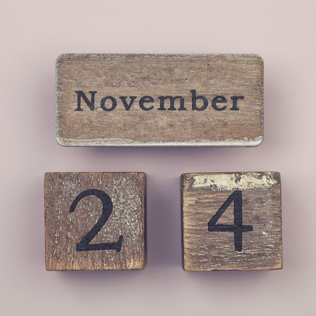 Wooden vintage calendar showing the date 24th of Novemberの写真素材