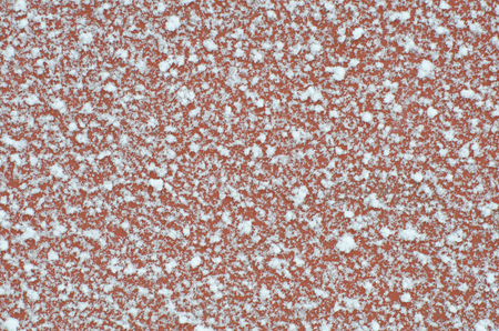 Red surface is covered with frostの写真素材