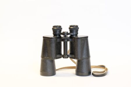 Binoculars on a white background. This is a vertical layout.の写真素材