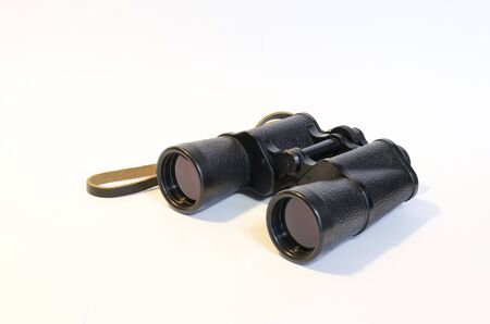 Binoculars on a white background. This is a side view.の写真素材