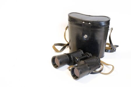 Black binoculars and case on a white background. This is a front view.の写真素材