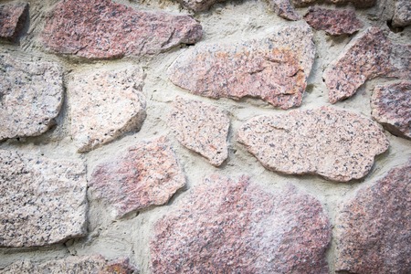 Stone wall seamless background or texture. Vignettedの写真素材