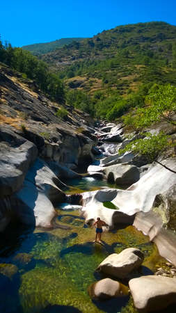 Los Pilones in Garganta de los Infiernos, Spain - August 12, 2014: People having fun in a river (III)のeditorial素材