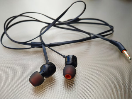 Black earphones on white backgroundの写真素材
