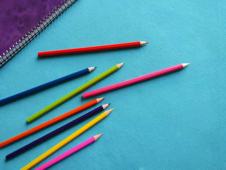 Back to school concept. Top horizontal view of school supplies on blue background. Color pencils and notebook. 3の写真素材