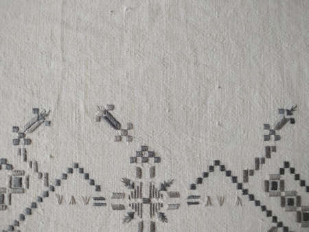 Geometric floral embroidery on canvas. Top view with copy space.の写真素材