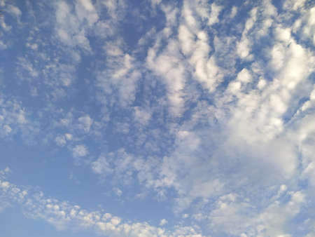 Bright blue sky background with fluffy clouds in the afternoonの写真素材