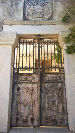 Marble entrance with forge door in an old Greek house in Naxos islandの写真素材
