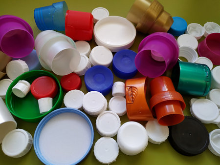 Pile of color plastic screw caps closeup