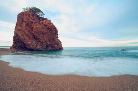 Big rock at Mediterranean beach.の写真素材