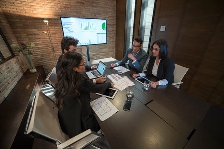 Business people discussing at meeting room.