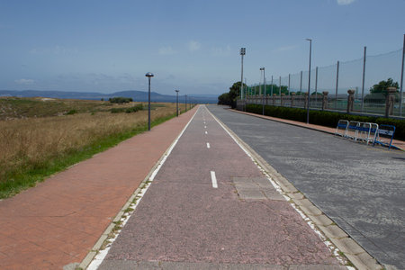bicycle lane parallel to the Roman lighthouse Torre de HÃ©rcules in A CoruÃ±a, Spainの写真素材