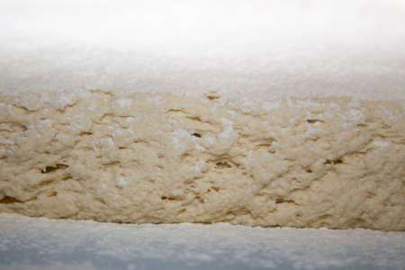 closeup of raw dough with flourの写真素材