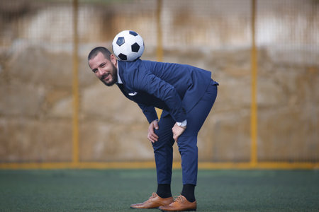 European Football Championship concept. Businessman playing soccer ball.の写真素材