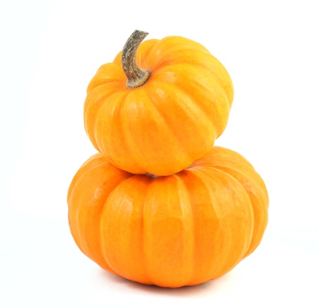 Two stacked mini pumpkins over whiteの写真素材