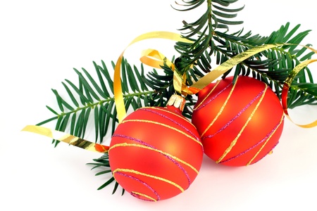 Two Christmas balls with christmas tree over whiteの写真素材